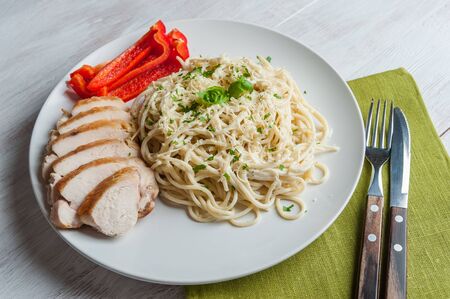 Italian spaghetti pasta with sauce and chicken, cheese parmesan and basil. Food background, selective focusの写真素材