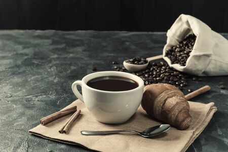 Breakfast with aromatic black coffee, good morning, great start to the day. Coffee break, copy space. Retro stylization, vintage film filterの写真素材