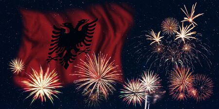 Holiday sky with fireworks and flag of Albania, independence day of countryの写真素材