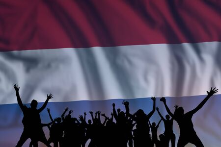 Peoples silhouette on flag and sky background, day of Netherlands, independence holiday の写真素材