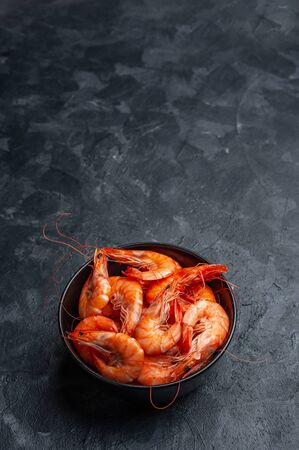 Boiled shrimps on bord prepared to cooking, fresh sea food. Cooking background, selective focusの写真素材