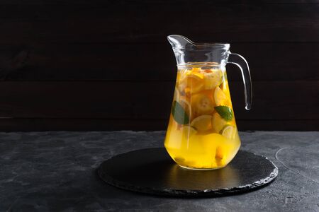 Homemade lemonade with mint from lemone and orange, citrus refreshig beverage in glass. Selective focusの写真素材
