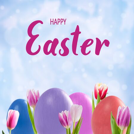 Easter colorful eggs and tulip flowers, holiday background for greetings card. Happy Easter hand letteringの写真素材