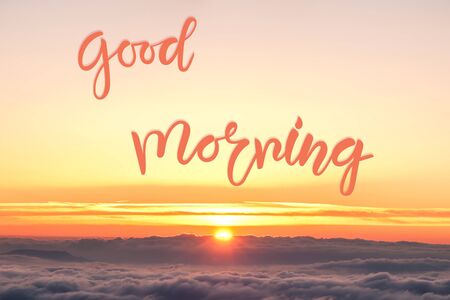Nature background with sunrise over clouds and Good morning hand lettering textの写真素材