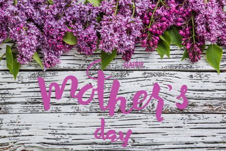 Holiday greetings card with lilac flowers and hand lettering text Happy Mothers Dayの写真素材