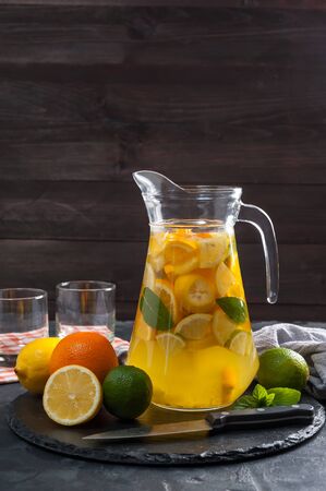 Homemade lemonade with mint from lemone and orange, citrus refreshig beverage in glass. Selective focusの写真素材