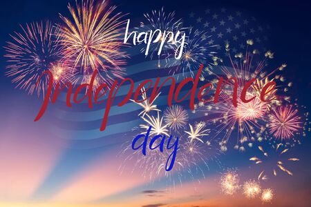 Holiday night sky with fireworks and flag of America and hand lettering text Happy Independence Dayの写真素材