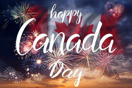 Holiday sky with fireworks and flag of Canada and hand lettering text, independence dayの写真素材