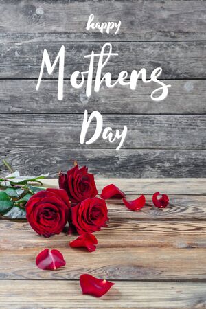 Holiday greetings card with rose flowers and hand lettering text Happy Mothers Dayの写真素材