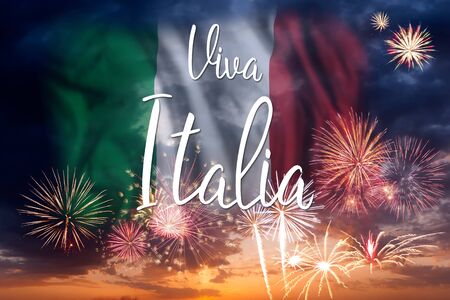 Freworks with flag of Italy in holiday sky and hand lettering text Viva Italia, independence dayの写真素材