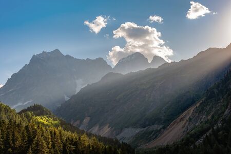 Beautiful landscape with sunny day in mountains. Majestic peaks and sky. Enjoy travel adventureの写真素材