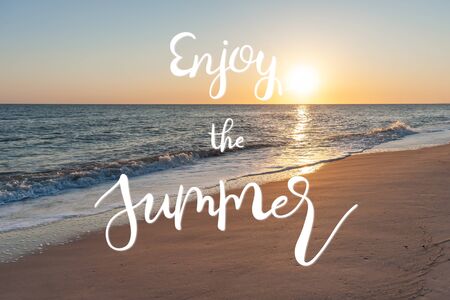 Summer landscape with blue sea and sandy beach and hand lettering text Enjoy the Summer, vacation backgroundの写真素材