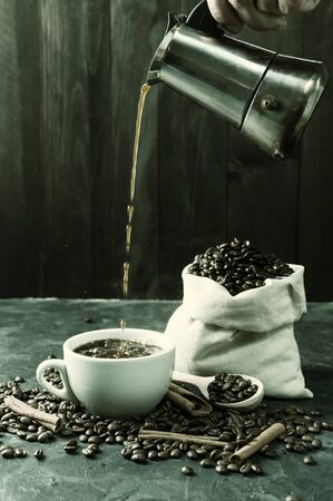Breakfast with aromatic black coffee, good morning, great start to the day. Coffee break, copy space. Vintage stylization, retro film filterの写真素材
