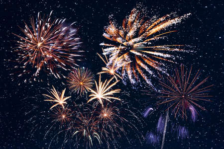 Beautiful fireworks in night sky during celebration, for New Year or Independence holiday cardの写真素材