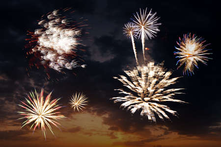 Beautiful fireworks in evening sky during celebration, for New Year or Independence holiday cardの写真素材