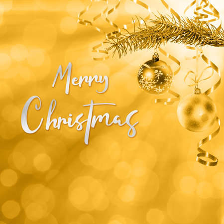 Golden Christmas and New Year holiday background with hand lettering textの写真素材
