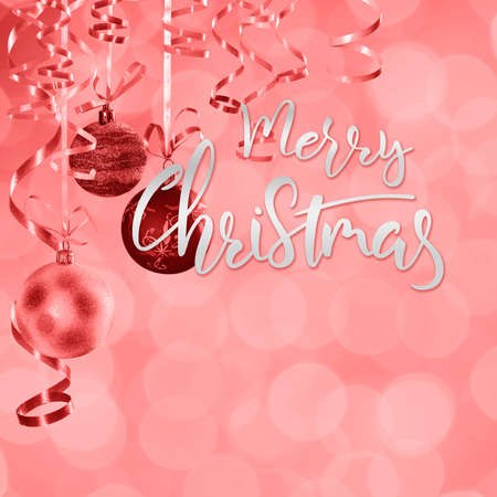 Christmas and New Year festive bokeh background with hand lettering textの写真素材