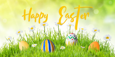 Painted eggs and flowers in green grass, Easter holiday background with hand lettering textの写真素材