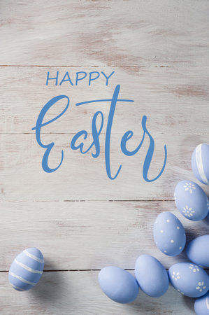 Easter colorful eggs on wooden backdrop, holiday background for your decoration. Egg hunt, "Happy Easter" letteringの写真素材