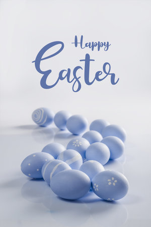 Easter painted eggs on white background with lettering text, holiday card for your decoration.の写真素材