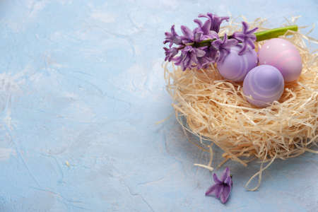Easter colorful card wuth eggs and flowers, holiday background, place for your text. Egg huntの写真素材
