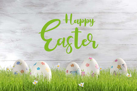 Easter painted eggs on wooden rustic table with hand lettering text, holiday background for your decoration. Decoupage eggs on colorful boardsの写真素材