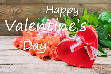 Valentine day holiday background with rose flowers and lettering textの写真素材
