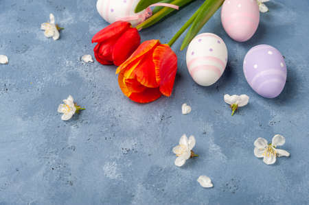 Easter colorful card with eggs and flowers, holiday background, place for your text. Egg huntの写真素材