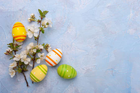 Easter colorful card with eggs and flowers and place for your text. Holiday background, egg huntの写真素材