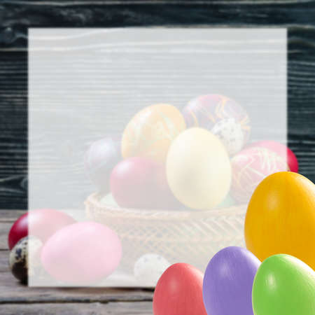Easter eggs on holiday card with white sheet for your textの写真素材