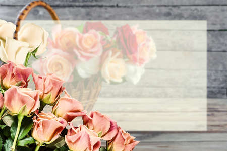Spring greetings card with rose flowers and place for your text on white sheetの写真素材