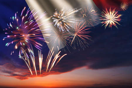 Holiday night sky with fireworks and flag of France for Independence dayの写真素材