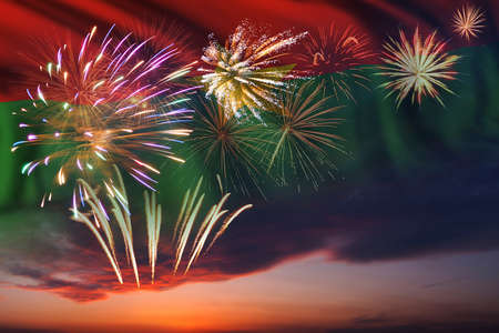 Holiday night sky with fireworks and flag of Burkina Faso for Independence dayの写真素材