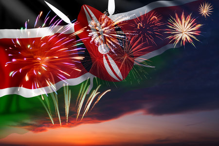 Holiday night sky with fireworks and flag of Kenya for Independence dayの写真素材