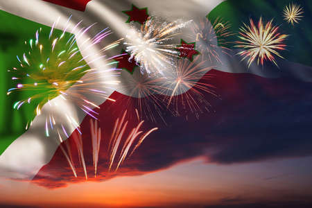 Holiday night sky with fireworks and flag of Burundi for Independence dayの写真素材