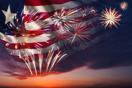 Majestic fireworks in evening skyHoliday night sky with fireworks and flag of Liberia for Independence dayの写真素材