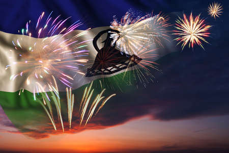 Majestic fireworks in evening skyHoliday night sky with fireworks and flag of Lesotho for Independence dayの写真素材