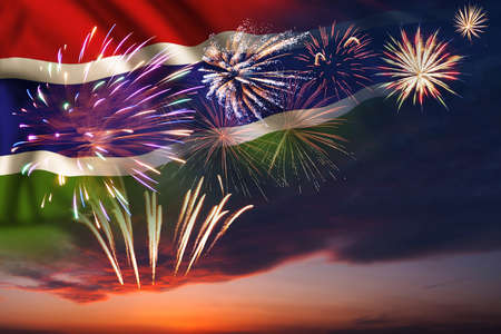 Majestic fireworks in evening skyHoliday night sky with fireworks and flag of Gambia for Independence dayの写真素材