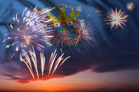Holiday night sky with fireworks and flag of Melilla for Independence dayの写真素材