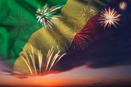 Holiday night sky with fireworks and flag of Republic of the Congo for Independence dayの写真素材
