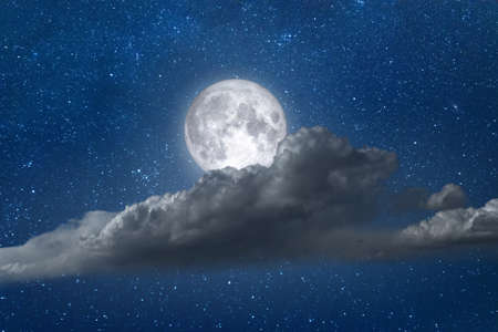 Night landscape full moon with clouds and stars in skyの写真素材