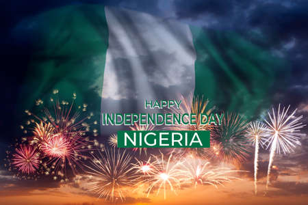 Holiday sky with fireworks and flag of Nigeria, independence dayの写真素材