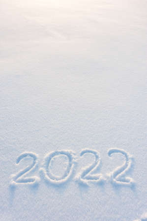 2022 holiday text draw on snow for New Year and Christmas card, place for your textの写真素材