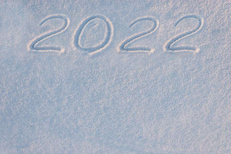 2022 holiday text draw on snow for New Year and Christmas card, place for your textの写真素材