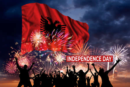 Holiday sky with fireworks and flag of Albania of Independence dayの写真素材