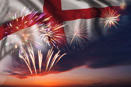 Majestic fireworks in evening sky and flag of England for Independence day or National Holidayの写真素材