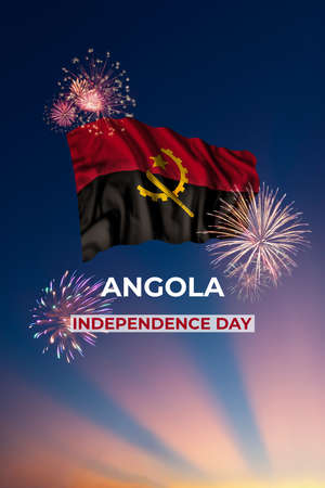 Holiday sky with fireworks and flag of Angola of Independence dayの写真素材