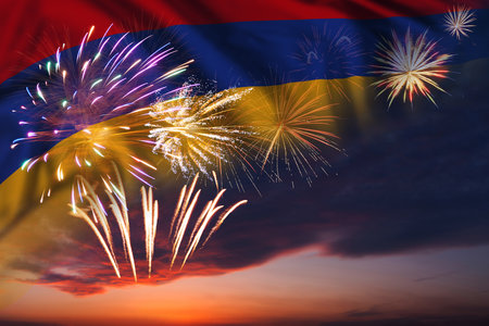 Majestic fireworks in evening sky and flag of Armenia for Independence day or National Holidayの写真素材