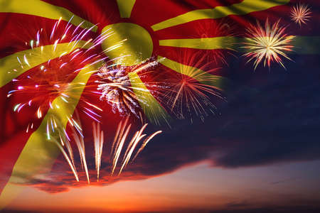 Majestic fireworks in evening sky and flag of Macedonia for Independence day or National Holidayの写真素材