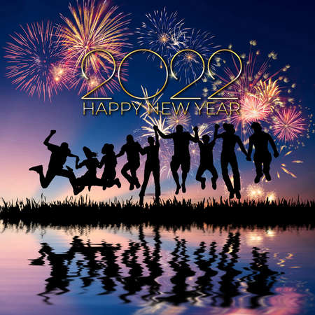 Holiday New Year 2022 greetings card with fireworks in sky and typography textの写真素材
